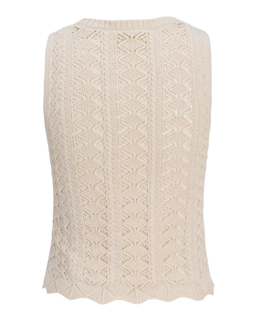 Bluse af strikket materiale med zigzag-mønster, placeret mod en hvid baggrund.