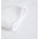 Detaljefoto af hvid Fifi boatneck bluse. Fra BySofieSønderby